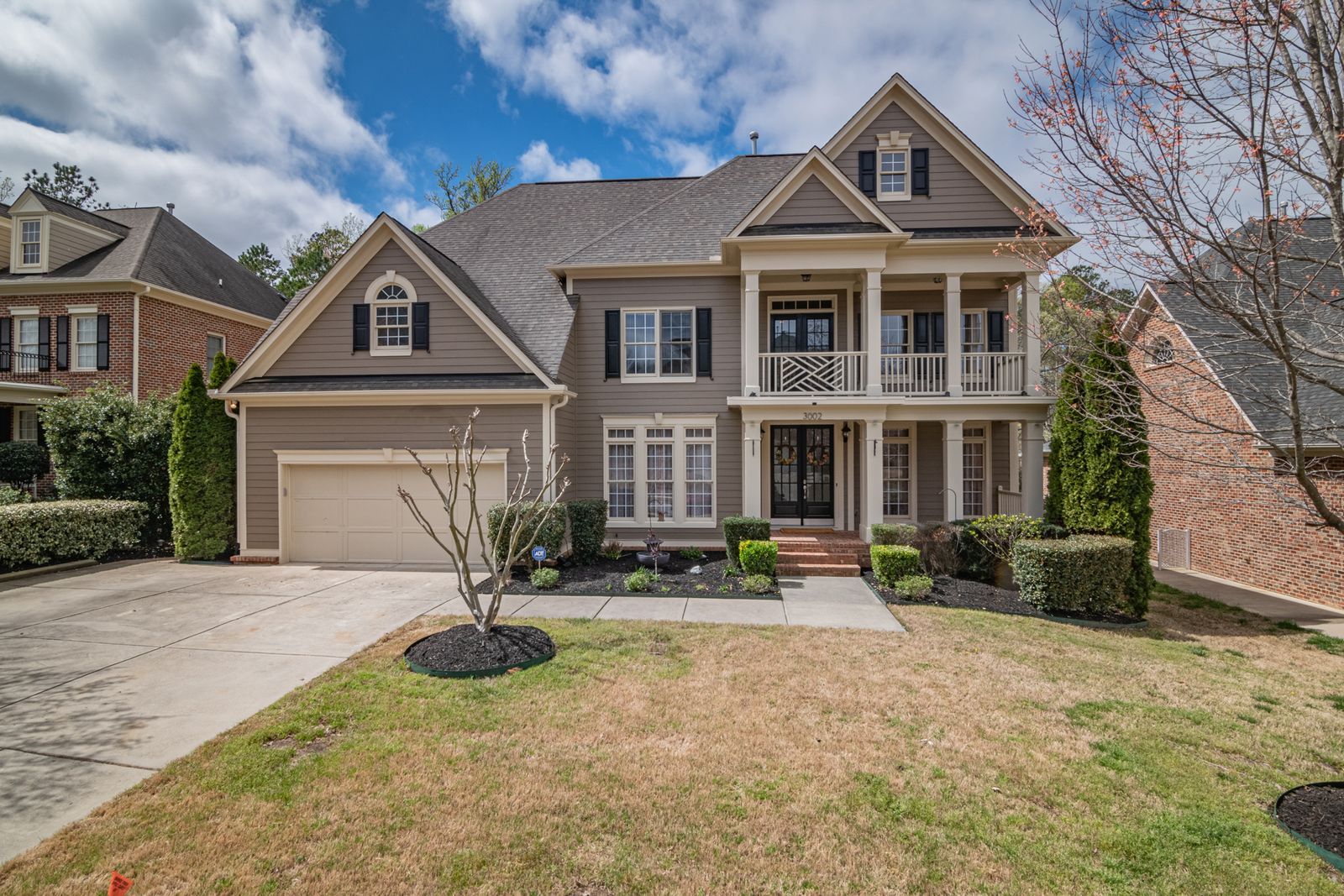 Classic two-story home with fiber-cement siding and balcony