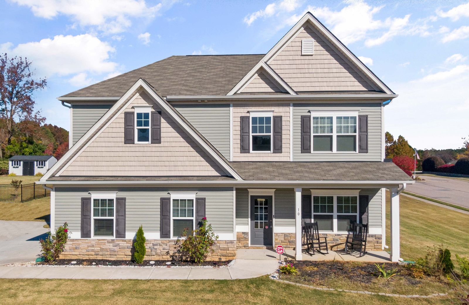Gray lap-siding home with covered front porch