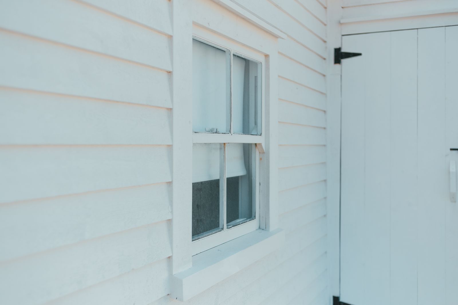 Crisp white lap siding with clean window trim